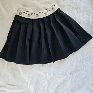 Chic Pleated Skort with Branded Waistband – Black & White